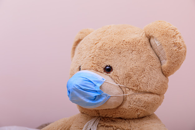 Teddy Bear wearing a face mask to protect against COVID-19 spread